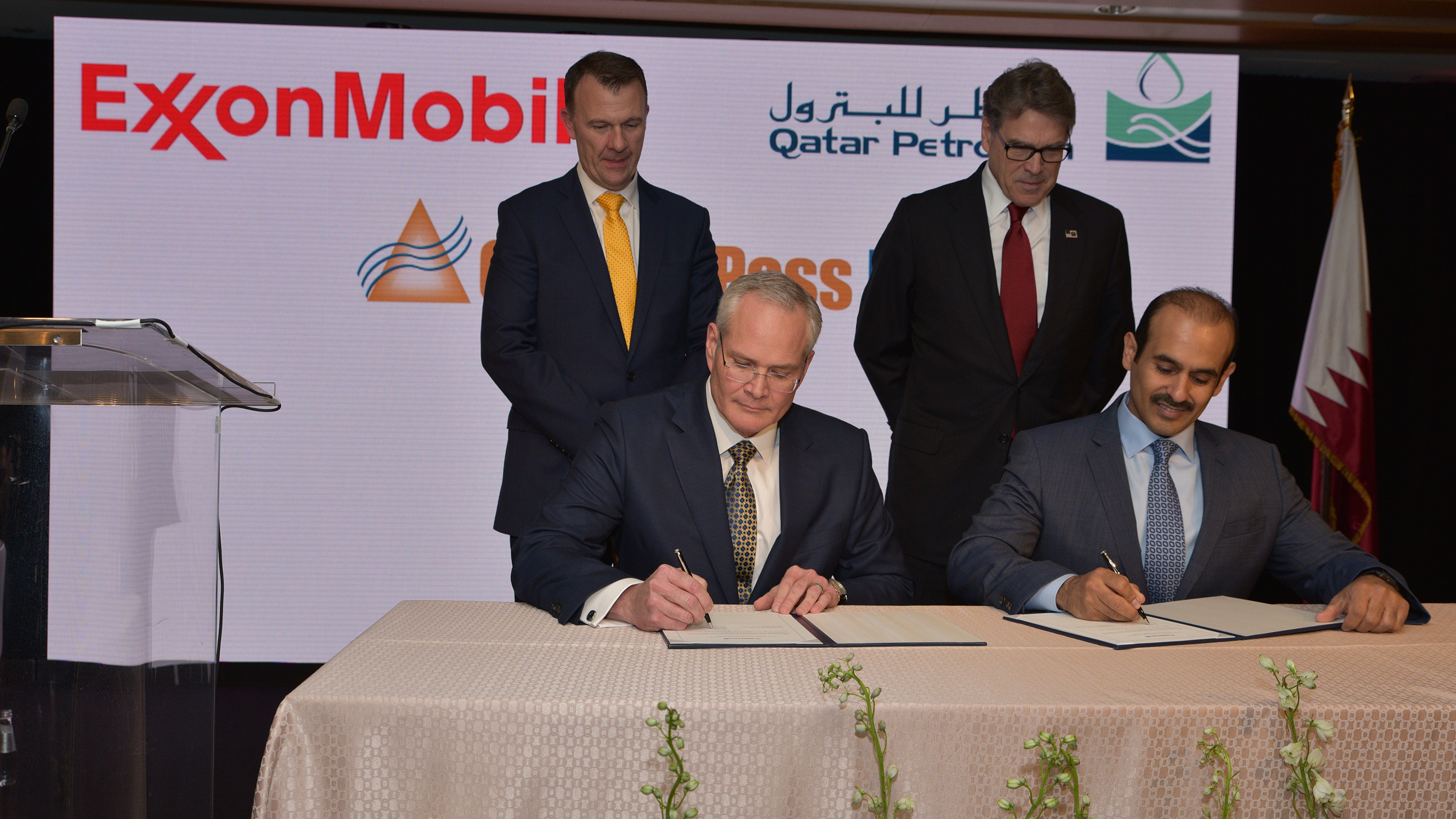 Image ExxonMobil Chairman and CEO Darren Woods and Qatar Petroleum President and CEO H.E. Saad Al-Kaabi sign agreement to proceed with construction of the Golden Pass LNG export facility as United States Energy Secretary Rick Perry and Golden Pass Products CEO Sean Ryan look on.